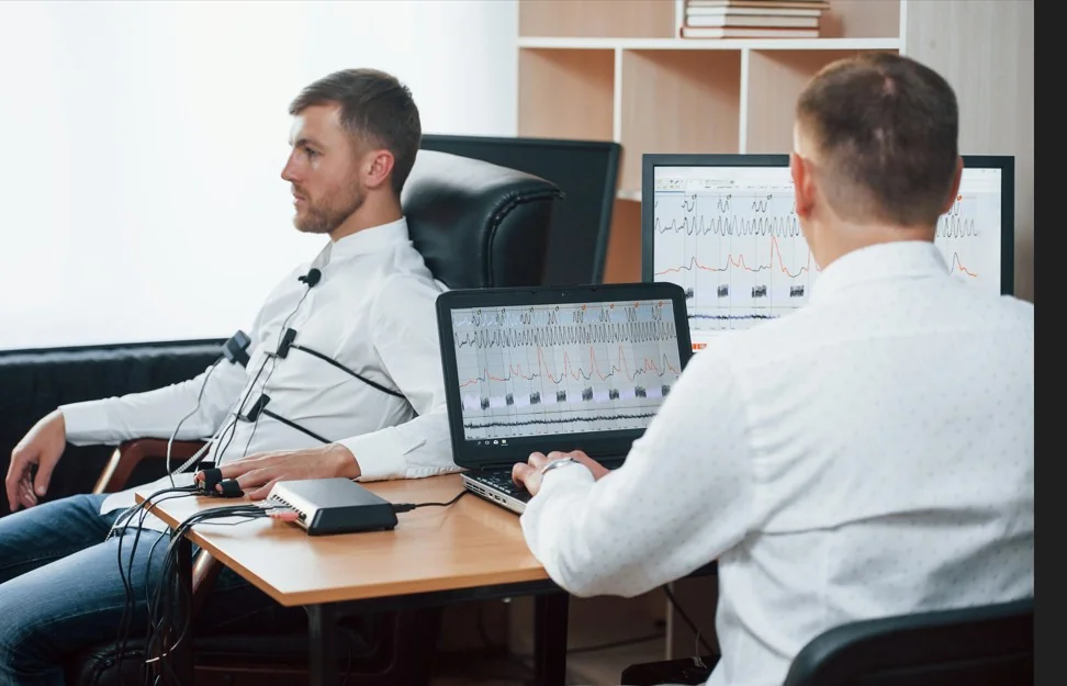 Close-up of calibrated polygraph examination equipment and monitoring instruments
